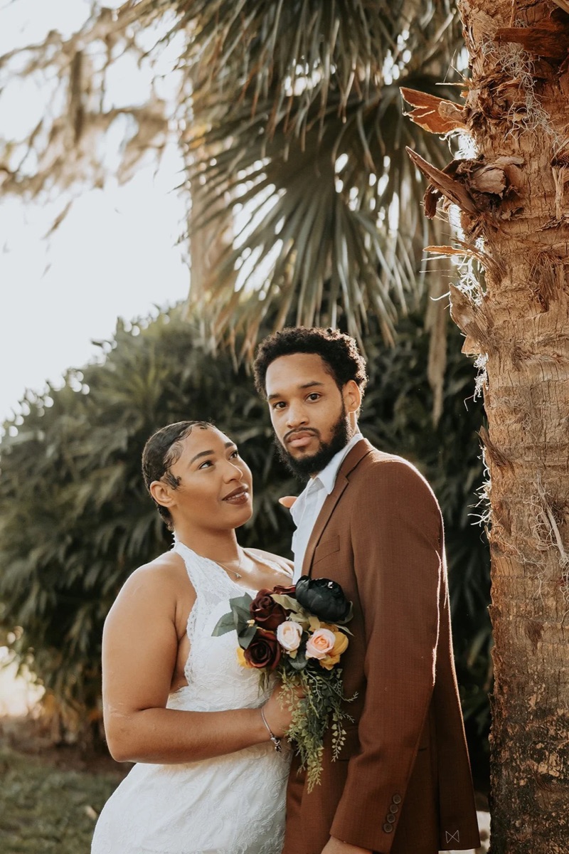 A couple photographed at an outdoor celebration