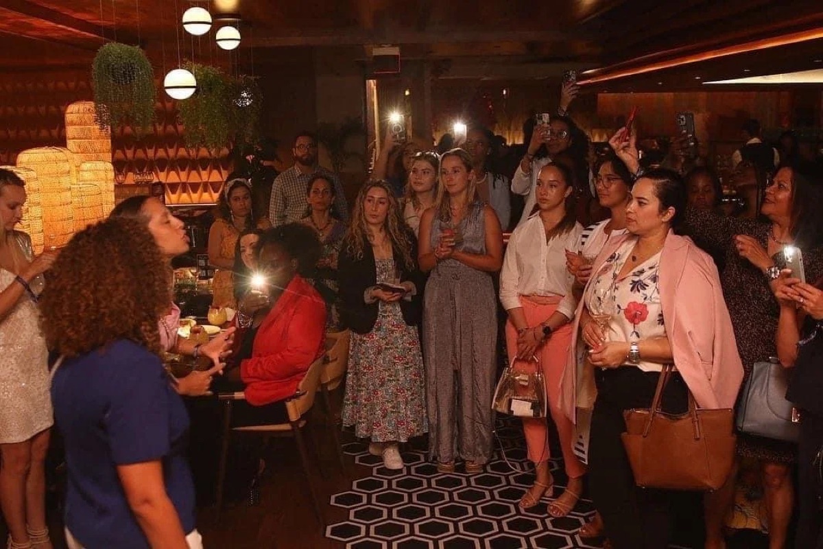 Guests filming and sharing content during an evening event