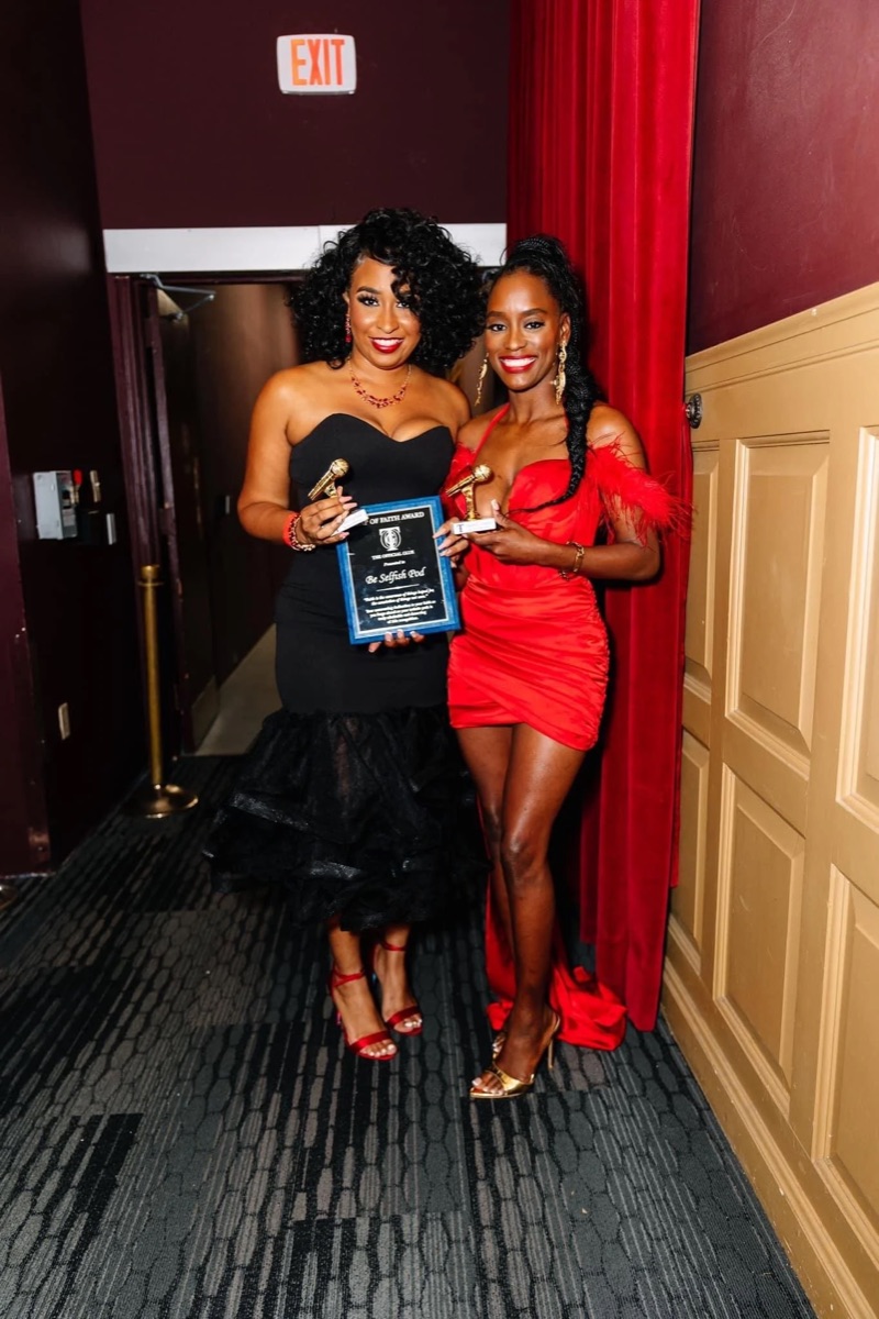 An award moment in a red gown