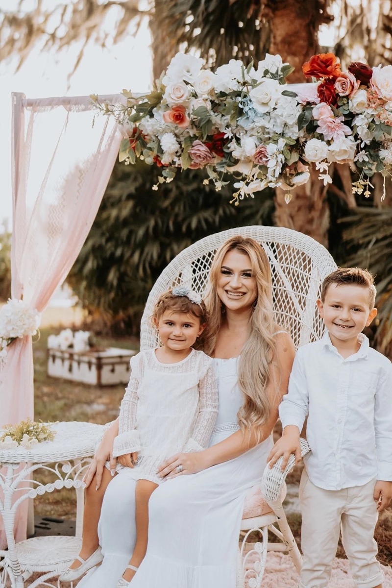 A family photographed at a styled outdoor set