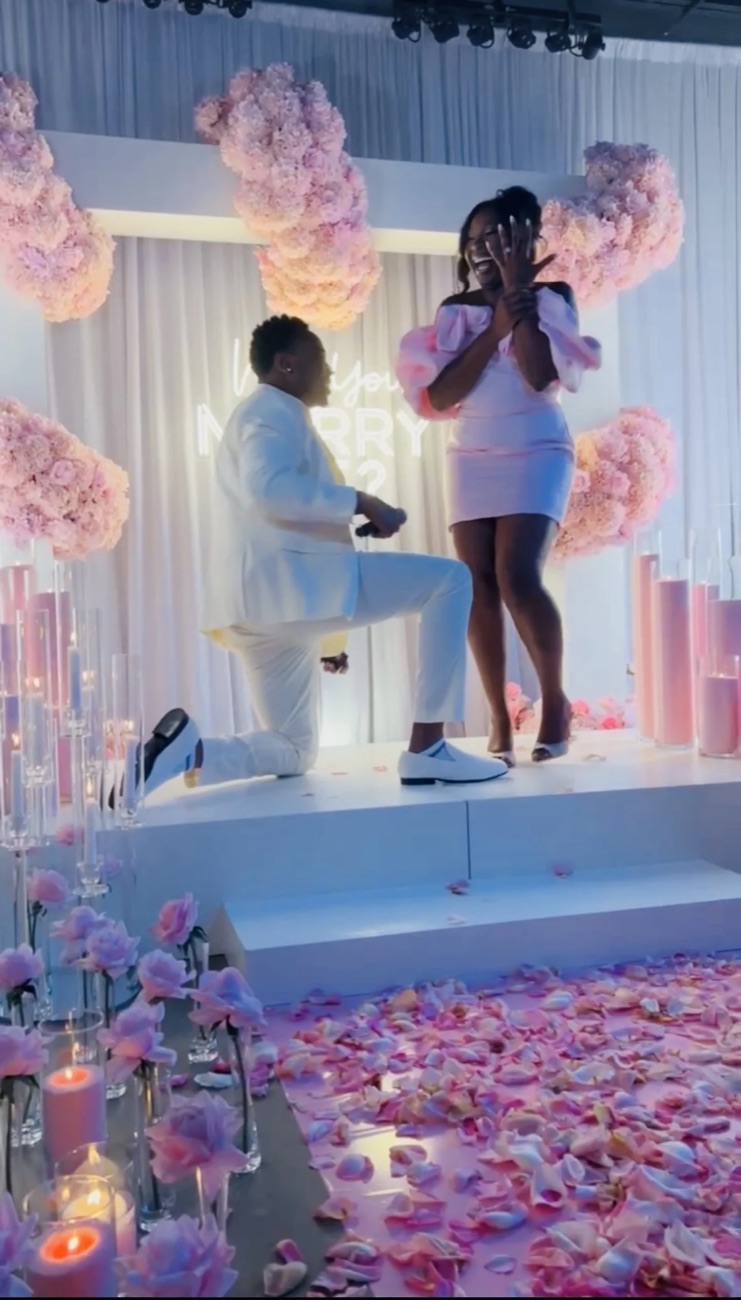 A proposal celebration captured in pink florals