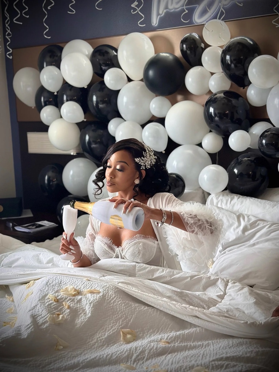 A bride celebrating in her wedding suite